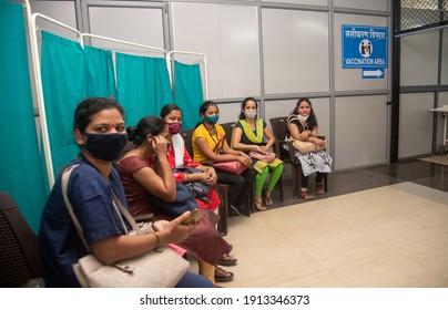 MUMBAI, MAHARASHTRA, INDIA - Feb 08, 2021: Police and health worker wait in queue for registration of Covid-19 coronavirus vaccine during the 2nd phase of vaccination drive at Shatabdi Hospital.