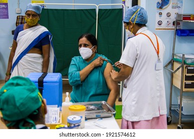 Mumbai, Maharashtra, India - January 20, 2021: An emergency health worker gets vaccinated with COVID-19 Covishield vaccine manufactured by Serum Institute of India (SII) at the Rajawadi Hospital.