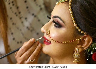 Mumbai Maharashtra India July 06 2019 Selective Focus Wedding Makeup Artist Making A Makeup For Bride Beautiful Indian Bride Getting Ready Close-up Of Face Bridal Makeup