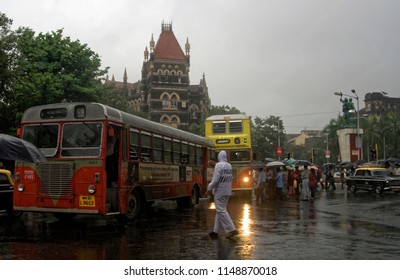 Mumbai Maharashtra India July 25 2008 Heavy Rain And People With Umbrella And Traffic Police Help To Clear The Road