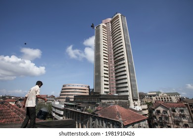 MUMBAI, MAHARASHTRA, INDIA : June 01, 2011 : A Man Doing Water Proofing On The Roof Of Old Buildings Before Rain Starts In The South Mumbai Near Stock Exchange Building, MUMBAI, MAHARASHTRA, INDIA