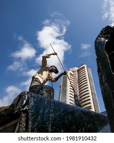 MUMBAI, MAHARASHTRA, INDIA : June 01, 2011 : A Man Doing Water Proofing On The Roof Of Old Buildings Before Rain Starts In The South Mumbai Near Stock Exchange Building, MUMBAI, MAHARASHTRA, INDIA