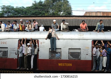 Mumbai, Maharashtra, India, Nov. 05, 2007 - Indian Commuters Travel On The Roof Of A Train Performing Stunts On Local Trains, 6 Billion Commuter Travel In Local Trains Of Western Railway Suburban