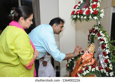 Mumbai; Maharashtra India: Sep. 09; 2013: Idol Of Lord Ganesh Pooja (Puja) Performing By Devotees; Family Before Immersion 