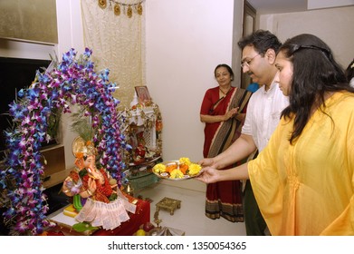 Mumbai; Maharashtra India: Sep. 19; 2012: Idol Of Lord Ganesh Pooja (Puja) Performing By Devotees Family Before Immersion 