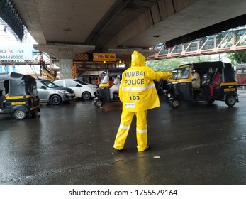 Mumbai, Maharastra/India- June 13 2020: A Traffic Police Officer Is Performing His Duty Even In Adverse Situation.