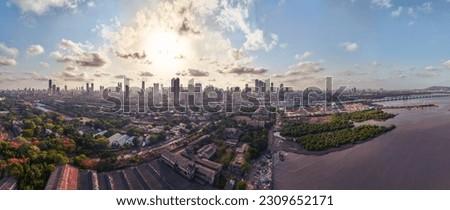 Mumbai Skyline with Dramatic Clouds at Sunset, Maharashtra, India. 