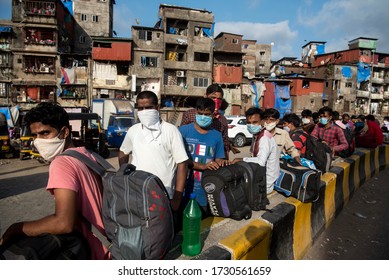 MUMBAI/INDIA - MAY 13, 2020: Migrant Workers Stand In Queue At Railway Terminus For Boarding A Special Train Back Home During A Nationwide Lockdown.