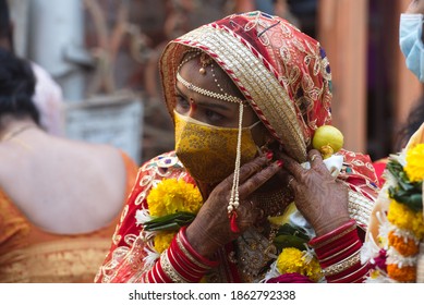 MUMBAI-INDIA - November 27, 2020: Bride wear mask after getting married at a temple in Bandra, amid the ongoing coronavirus pandemic.