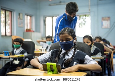 MUMBAI-INDIA - October 27, 2020: Students Access E-learning Contents On Mobile Phones During A Class As Part Of 'Online Education Mobile Library' At  Imamwada,