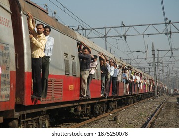 MUMBAI,MAHARASHTRA, INDIA-FEB 12,2009 Mumbai Commuters Travel On Local Train During Peak Hours. Almost Around 6 Billion Commuters Travel In Local Trains Of Western Railways. MUMBAI,MAHARASHTRA,INDIA