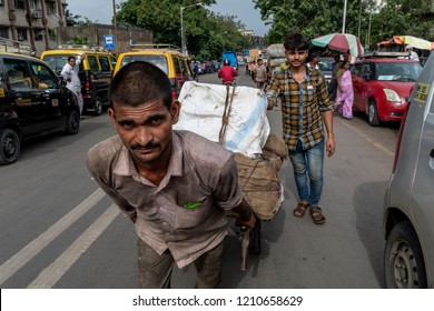 Mumbai,Maharashtra,India 8-2-2018. Manual Street Goods Porters Of Mumbai. Daily Wages Workers Poor Migrants From Underdeveloped Rural India