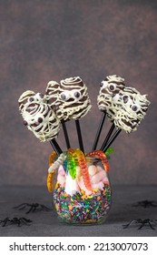 Mummy Shaped Chocolate Cake Pops And Gummy Worms For Halloween Party