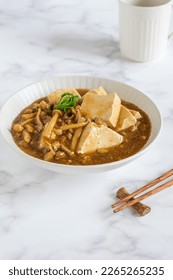 Mun tahu or mun tofu is a chinese dish made from tofu, minced meat and mushroom