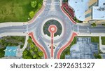 Muncie, IN aerial above Passing of the Buffalo statue in roundabout straight down shot of road