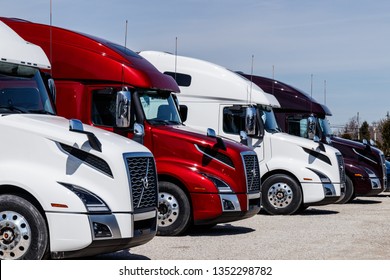 Muncie - Circa March 2019: Colorful Volvo Semi Tractor Trailer Trucks Lined up for Sale. Volvo is one of the largest truck manufacturers II