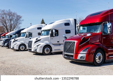 Muncie - Circa March 2019: Colorful Volvo Semi Tractor Trailer Trucks Lined up for Sale. Volvo is one of the largest truck manufacturers V