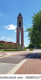 Muncie, Indiana - United States - 7-7-21: Ball State University Bell Tower Withe Road, Walkways, Trees, Blue Skies And Clouds