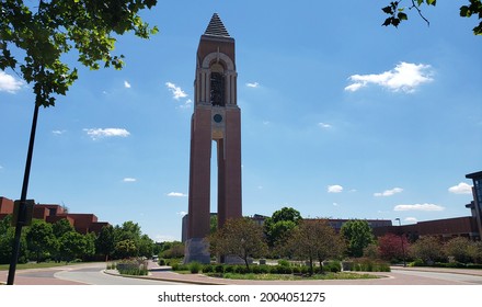 Muncie, Indiana - United States - 7-7-21: Ball State University Bell Tower With Trees, Blue Skies And Clouds