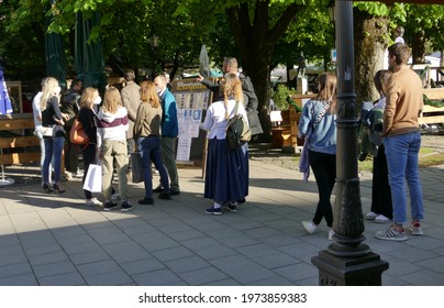 Munich, Bavaria, Germany - 05.14.2021:  Changing Of Corona  Covid Rules, Opening Beer Garden Munich City, Viktualienmarkt. People Lining Up For Beer Garden Visit. 