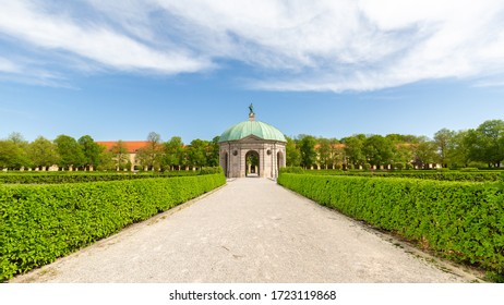 Munich, Bavaria / Germany - Apr 21, 2020: Path Lined With Hedges Leading Towards Dianatempel (temple Of Diana). Pavilion Located Inside The Hofgarten. Popular Destination For Tourists. Panorama Format