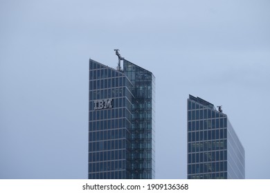 Munich, Bavaria Germany - February 3 2021: IBM International Business Machines Corporation Logo German Headquarters Tower. Watson IoT Center Artificial Intelligence Research And Development Building.