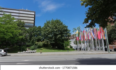 Munich, Bavaria / Germany - July 05, 2020: building of the "European Patent Office" with all European flags in front, blue sky