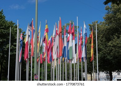 Munich, Bavaria / Germany - July 05, 2020: all European flags in front of the building of the "European Patent Office", blue sky