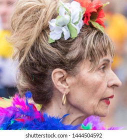 MUNICH, BAVARIA / GERMANY - JULY 14, 2018: An Older Woman In A Colorful Dress With Feathers Attending The Gay Pride Parade Also Known As Christopher Street Day (CSD) In Munich, Germany. 