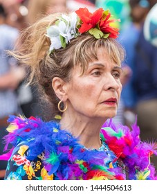 MUNICH, BAVARIA / GERMANY - JULY 14, 2018: An Older Woman In A Colorful Dress With Feathers Attending The Gay Pride Parade Also Known As Christopher Street Day (CSD) In Munich, Germany. 