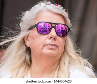 MUNICH, BAVARIA / GERMANY - JULY 14, 2018: An Older Woman With Glasses Attending The Gay Pride Parade Also Known As Christopher Street Day (CSD) In Munich, Germany.