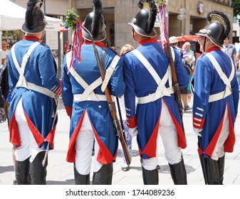 Munich, Bavaria / Germany - June 18, 2017: Group Of Costumed Men In A Traditional Patriotic Uniform Of The Munich Militia With Shouldered Arms Posing At The Festival Of The Foundation Of The Town