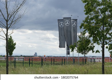 Munich, Bavaria/Germany - August 23, 2020: Flags With Mercedes-Benz Logo Beside A Car Dealer Building, Cloudy Sky. Mercedes-Benz Is A Global Auto Brand, A Division Of The German Company Daimler AG