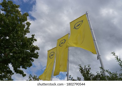 Munich, Bavaria/Germany - August 23, 2020: Flags With Opel Logo In Front Of A Car Dealer Building. Opel Is A Global Automobile Brand.