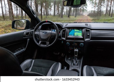 Munich Germany 1 February 2020 Ford Ranger Raptor T6 Mid-size Pickup Truck Stands On Forest Road. Raptor Interior Dashboard View. Background Forest With Forest With Pine Trees.