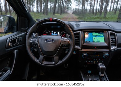 Munich Germany 1 February 2020 Ford Ranger Raptor T6 Mid-size Pickup Truck Stands On Forest Road. Raptor Interior Dashboard View. Background Forest With Forest With Pine Trees.