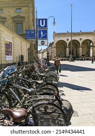 Munich, Germany 16.4.2022 Bicycle Parking Next To U Bahn Metro Underground Station. Bicycles Parked Next To Entrance To Metro Station In Munich City Center