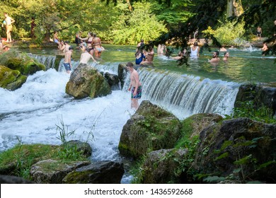 MUNICH, GERMANY - August 2018: Abnormal Heat In The City. People Are Trying To Escape From The Heat Swimming In A Dangerous River Despite The Ban.