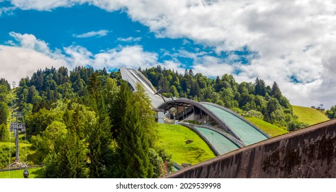 Munich, Germany - August 2021: Side View Of Olympia Ski Jump And Cable Car View Of The Alps. Olympic Town Of Garmisch-Partenkirchen. Alps Bavaria Europe