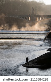 Munich, Germany - December 19 2021: Bridge On The Isar River On Winter Day.