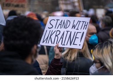 MUNICH, GERMANY - Feb 26, 2022: Posters with the slogan "Stand with Ukraine" at peace demonstration in Munich after Russia invaded Ukraine - Shutterstock ID 2158626913
