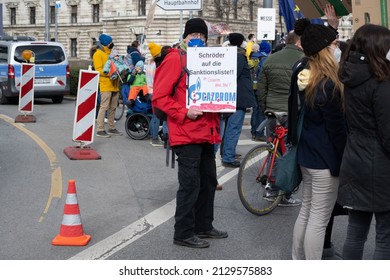 Munich, Germany - February 26, 2022: Man Holding A Sign At A Protest Against The Russian War Against Ukraine In Karlsplatz (Stachus), Calling For Former Chancellor Gerhard Schröder To Be Sanctioned.