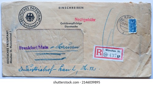 Munich, GERMANY January 22 ,1951:
Envelope with window and sender German	patent office in Munich. Postage due, emergency sacrifice stamp Berlin. registered mail No. 13 b 437 AP