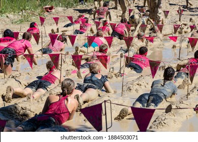 Munich, Germany - July 1, 2018: Women's Muddy Angels Mud Crawl During A Breast Cancer Beneficial Event