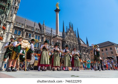 MUNICH, GERMANY - JULY 25, 2017: Music band in traditional bavarian clothes in front of Marienplatz town hall in Munich, Germany in a beautiful summer day