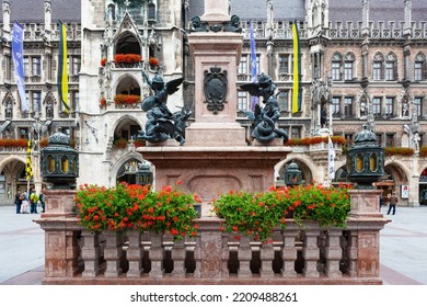 Munich, Germany - July 4, 2011 : Figures Of Angels Slaying Dragons At Base Of Mariensaule (Mary's Column) At Marienplatz.