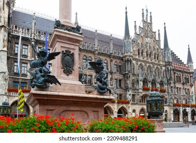 Munich, Germany - July 4, 2011 : Figures Of Angels Slaying Dragons At Base Of Mariensaule (Mary's Column) At Marienplatz.