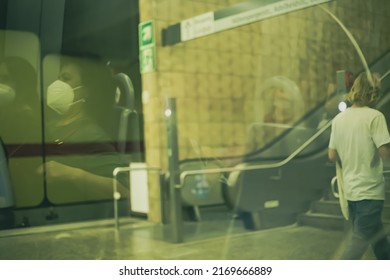 Munich, Germany- Jun 3rd 2021: View Through The Train Window In The Subway. Passenger Reflection With Face Masks On Glass.