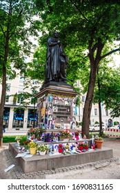 MUNICH, GERMANY - May 27 : Souvenirs Of Michael Jackson Placed Around A Statue At Promenadenplatz To Remember The Anniversary Of Death Of Michael Jackson May 27, 2019 In Munich.