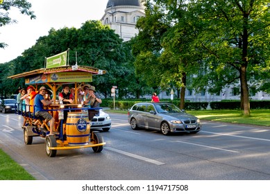 Munich, Germany - May 31, 2011: Young People Peddle A Beer Bike Through The Streets Of Munich In Germany.